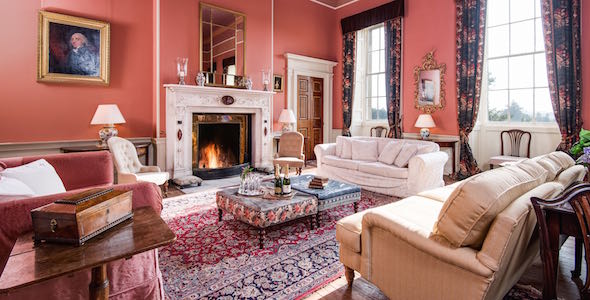 The drawing room is the principal reception room, with cosy furnishing and distant views across the South lawn. 