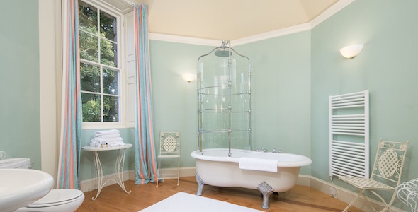Bedroom 'The Glorious 12th' bathroom, in a fairytale octagonal turret with vaulted ceiling and a fabulous rain bath. 